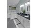 Bathroom featuring dual sink vanity, soaking tub, and stylish fixtures at 4407 Beauvista Dr, Charlotte, NC 28269