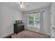 Bright bedroom featuring a ceiling fan, natural light, and neutral walls at 4407 Beauvista Dr, Charlotte, NC 28269