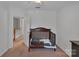 Neutral bedroom with a wood crib and view of the hallway at 4407 Beauvista Dr, Charlotte, NC 28269