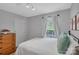 Inviting bedroom features ample natural light and neutral walls at 4407 Beauvista Dr, Charlotte, NC 28269