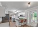 Bright kitchen with stainless steel appliances, island seating, and adjacent breakfast nook at 4407 Beauvista Dr, Charlotte, NC 28269