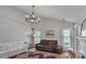 Bright living room featuring hardwood floors, stylish furnishings, and a modern chandelier at 4407 Beauvista Dr, Charlotte, NC 28269