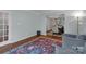 Comfortable living room flowing into dining area, featuring hardwood floors and natural light at 4407 Beauvista Dr, Charlotte, NC 28269