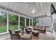 Inviting screened porch with comfortable seating and outdoor views at 4407 Beauvista Dr, Charlotte, NC 28269