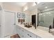 Modern bathroom featuring double sinks, white cabinetry, and a glass-enclosed shower at 4520 Radler Ct, Charlotte, NC 28217