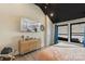 A bedroom with ample natural light, modern furniture and a flat screen TV at 4520 Radler Ct, Charlotte, NC 28217