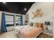 Bright bedroom with black ceiling, unique wall art, and natural light for comfort at 4520 Radler Ct, Charlotte, NC 28217