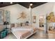 This bedroom features unique decor, a comfortable bed, and a view into the bathroom at 4520 Radler Ct, Charlotte, NC 28217
