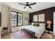 Stylish bedroom with a queen-size bed, accent wall, large window, and modern furnishings at 4520 Radler Ct, Charlotte, NC 28217