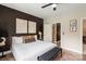 Stylish bedroom with a queen-size bed, accent wall, and modern furnishings at 4520 Radler Ct, Charlotte, NC 28217