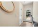 Bright entryway with wood-look floors, a decorative mirror, and a view to the green front yard through the glass door at 4520 Radler Ct, Charlotte, NC 28217