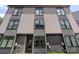 Modern townhome featuring neutral siding, dark trim, and plenty of large windows at 4520 Radler Ct, Charlotte, NC 28217