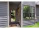 Inviting front entrance with a glass door, visible house number, and well-maintained landscaping for a welcoming approach at 4520 Radler Ct, Charlotte, NC 28217