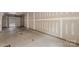 Spacious unfinished garage with concrete floors, ample wall space, and a garage door for convenient parking and storage at 4520 Radler Ct, Charlotte, NC 28217