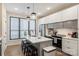 Bright kitchen with stainless appliances, center island with seating and stylish pendant lighting at 4520 Radler Ct, Charlotte, NC 28217