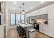 Bright kitchen with stainless appliances, center island with seating and stylish pendant lighting at 4520 Radler Ct, Charlotte, NC 28217