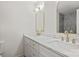Elegant bathroom with double vanity, marble countertop, gold fixtures, and gray tiled shower at 4633 Cringle Ct, Charlotte, NC 28226