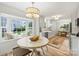 Bright breakfast nook featuring a large bay window and stylish lighting at 4633 Cringle Ct, Charlotte, NC 28226