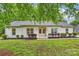 Charming brick ranch home with a well-manicured lawn and tidy landscaping at 4633 Cringle Ct, Charlotte, NC 28226