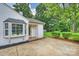 Home exterior featuring a side entrance, bay window, and well-maintained landscaping at 4633 Cringle Ct, Charlotte, NC 28226