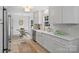Modern kitchen with white cabinets, stainless steel appliances, and a breakfast area at 4633 Cringle Ct, Charlotte, NC 28226