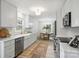 Bright, updated kitchen with white cabinets, stainless appliances, and stylish fixtures at 4633 Cringle Ct, Charlotte, NC 28226