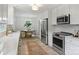Updated kitchen boasts stainless steel appliances and a seamless design connecting to the dining area at 4633 Cringle Ct, Charlotte, NC 28226