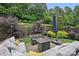 Serene backyard featuring a cozy seating area with lush greenery and a tranquil ambiance at 5118 Waldron Meadow Dr, Charlotte, NC 28226