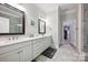 Modern bathroom features double vanities, quartz counters, and access to a walk-in closet at 5118 Waldron Meadow Dr, Charlotte, NC 28226