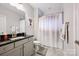 Well-lit bathroom features gray vanity with a dark countertop and shower-tub combination at 5118 Waldron Meadow Dr, Charlotte, NC 28226