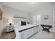 Relaxing bedroom features a comfortable bed, soft lighting, and a glimpse into the closet at 5118 Waldron Meadow Dr, Charlotte, NC 28226