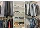 Organized walk-in closet providing ample storage with multiple shelves, hanging rods, and shoe racks at 5118 Waldron Meadow Dr, Charlotte, NC 28226