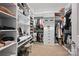 Spacious walk-in closet with custom shelving, drawers, and ample storage space at 5118 Waldron Meadow Dr, Charlotte, NC 28226