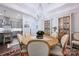 Cozy dining area with wooden table, upholstered chairs, and stylish built-in cabinets at 5118 Waldron Meadow Dr, Charlotte, NC 28226