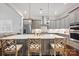 Bright kitchen featuring a large island, stainless steel appliances, and comfortable seating at bar at 5118 Waldron Meadow Dr, Charlotte, NC 28226