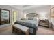 Comfortable main bedroom with a decorative headboard, bench, and ensuite bathroom at 5118 Waldron Meadow Dr, Charlotte, NC 28226