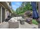 Outdoor patio area with comfortable seating, a fire pit, and lush landscaping at 5118 Waldron Meadow Dr, Charlotte, NC 28226