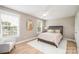 This cozy bedroom offers great natural light, ceiling fan, and fresh neutral colors at 517 E Main St, Rock Hill, SC 29730