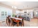 Modern kitchen with white cabinets and island seating open to dining at 517 E Main St, Rock Hill, SC 29730