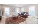 Cozy living area featuring hardwood floors and bright sunny windows at 517 E Main St, Rock Hill, SC 29730