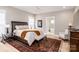 Serene bedroom with hardwood floors and en-suite bathroom at 517 E Main St, Rock Hill, SC 29730