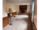 Living Room with a brick fireplace and wood-paneled walls at 6561 Weldon Nw Cir, Concord, NC 28027