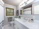Bathroom featuring a white vanity, framed mirror, and neutral fixtures at 6941 Queensberry Dr, Charlotte, NC 28226