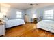 Bedroom with hardwood floors and a ceiling fan at 6941 Queensberry Dr, Charlotte, NC 28226