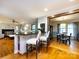 Kitchen bar with seating leading into the living room and dining area at 6941 Queensberry Dr, Charlotte, NC 28226