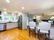 Bright kitchen featuring stainless steel appliances, breakfast bar, and light grey cabinetry at 6941 Queensberry Dr, Charlotte, NC 28226
