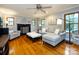 Inviting living room featuring a fireplace, comfortable seating, and natural light at 6941 Queensberry Dr, Charlotte, NC 28226