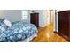 Bedroom showcasing hardwood floors, and ensuite bathroom access at 6941 Queensberry Dr, Charlotte, NC 28226