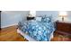 Comfortable primary bedroom featuring hardwood floors, warm lighting, and stylish bedding at 6941 Queensberry Dr, Charlotte, NC 28226