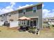 Townhome backyard with patio, seating area, and lawn at 7024 Jane Parks Way, Charlotte, NC 28217